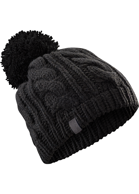 Cable Pom Pom Hat Heavy weight wool/acrylic yarns create a warm, chunky cable knit hat with large pom pom.